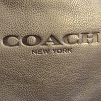 最近买了几个包 篇二：Coach 牛皮双肩背包