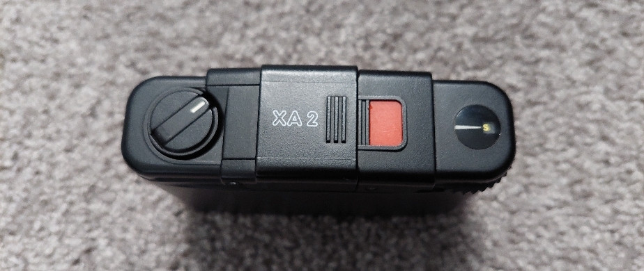 Olympus XA2估焦拨杆无法转动镜头伸缩的故障修复