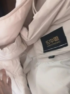 认证挑战赛。雪中飞冬季羽绒服女连帽中长款