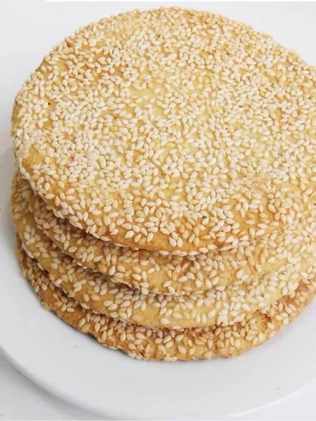  p>炕炕馍,又叫作烙芝麻饼,是陕西汉中汉阴民间的一种特色小吃.