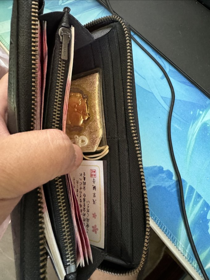 蔻驰男士手包