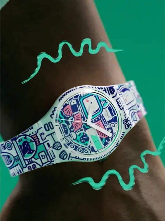 瑞士斯沃琪 Swatch BREAK FREE 系列「B-BOT」腕表，艺术家 Bao Ho 趣味创造富有生命力的 B-Bot 角色。 
腕表日历窗口“生命力/电池能量”设计焕发激扬态度
节奏音响、舞