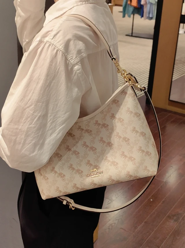 COACH蔻驰︳白色马车图案Laurel流浪包