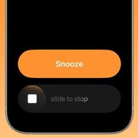 苹果推iOS 26.1 Beta 2：优化闹钟、增强AI与AirPods翻译功能
