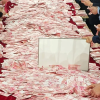 河南一公司年会变大型数钱现场！员工领钱数了近10万：手都抽筋了