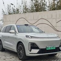 无保护左转成功率超99%？华为ADS 4.0与Momenta R6在暴雨夜行、施工路段中的真实表现对比