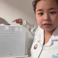 新贝三合一：集消毒、烘干、摇奶与保温于一体的母婴设备