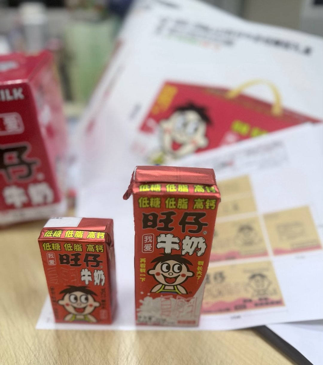 被骂“太甜”的第4天,旺仔牛奶官宣低糖了:把含糖量、国标和财报都核了一遍,这罐到底怎么等