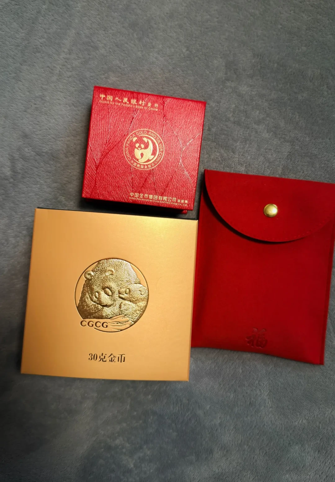 金价从高位回落,45岁的熊猫金币开始