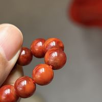 南红里有黑点白线是假的吗？搞懂这几种杂质，买料不吃亏