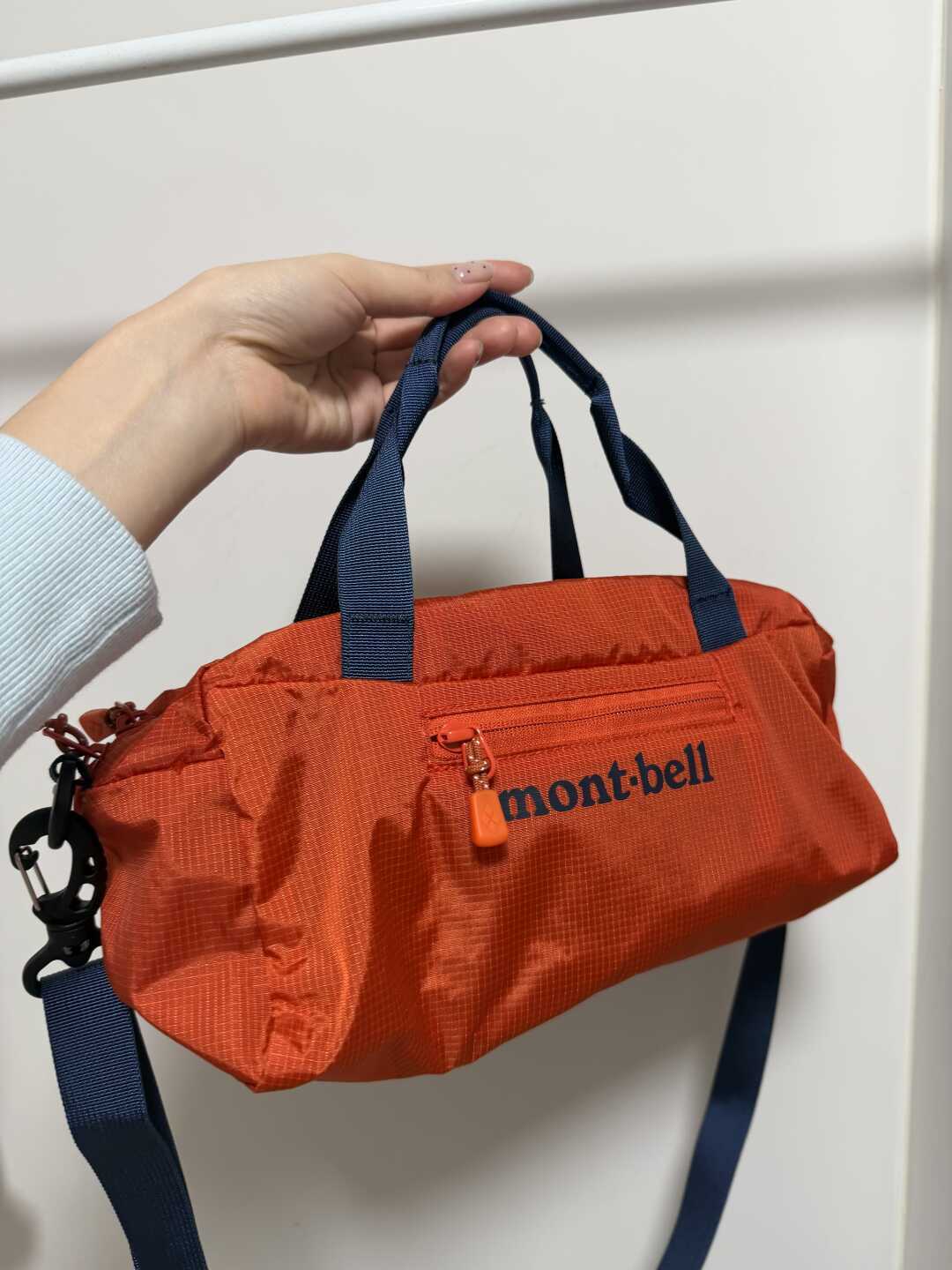 拉链头鉴真法刚被专柜党推翻：双11抢montbell保龄球包前，先对完差价、补货、内胆三本账