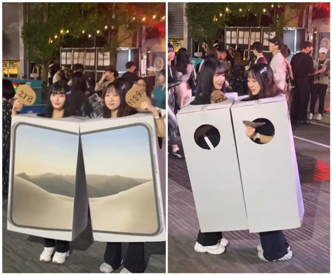 万圣节最硬核COS！两名女生扮成iPhone Duo：手举2TB牌子引众人围观